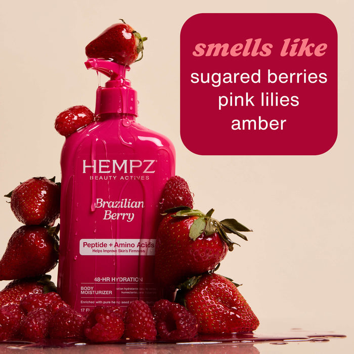 Hempz Beauty Actives Brazilian Berry Moisturizing Body Lotion with Peptides + Amino Acids surrounded by strawberries with a text box indicating fragrance notes.