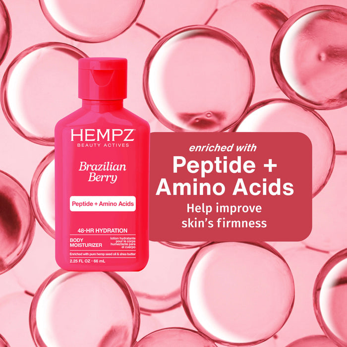 Hempz Brazilian Berry body moisturizer bottle on a pink background with product details.