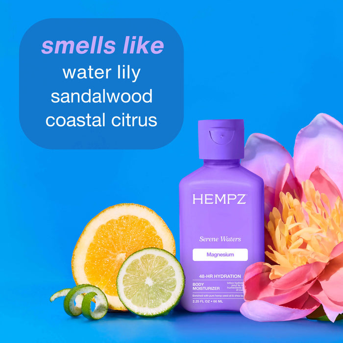 Hempz Serene Waters with Magnesium mini bottle with floral and citrus elements on a blue background