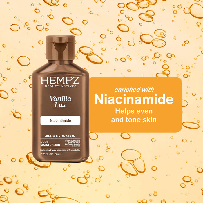 Hempz Travel-Size Beauty Actives Vanilla Lux Body Moisturizing Lotion with Niacinamide bottle with oil droplets on a beige background