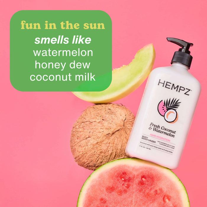 Hempz Fresh Coconut & Watermelon body lotion with watermelon, coconut, and honey dew on a pink background
