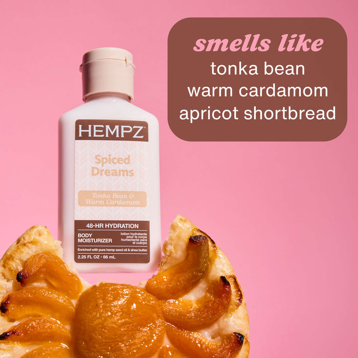 Hempz Travel-Size Spiced Dreams Moisturizing Body Lotion on a dessert with scent notes