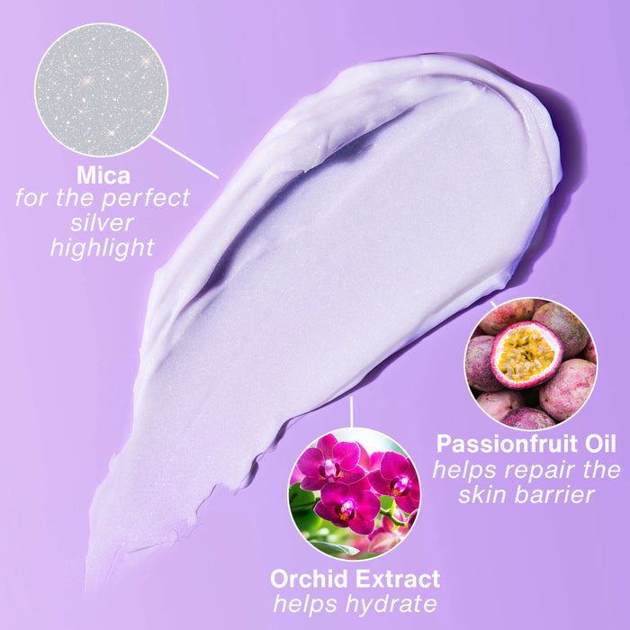 Close-up of a purple skincare product with text highlighting mica, passionfruit oil, and orchid extract on a purple background.