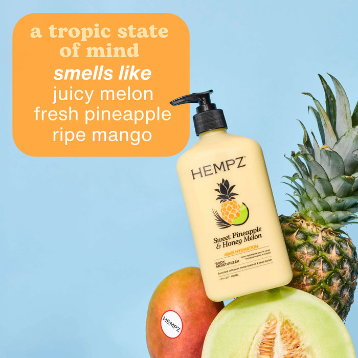 Hempz Sweet Pineapple & Honey Melon shampoo bottle with melon, pineapple, and mango on a blue background