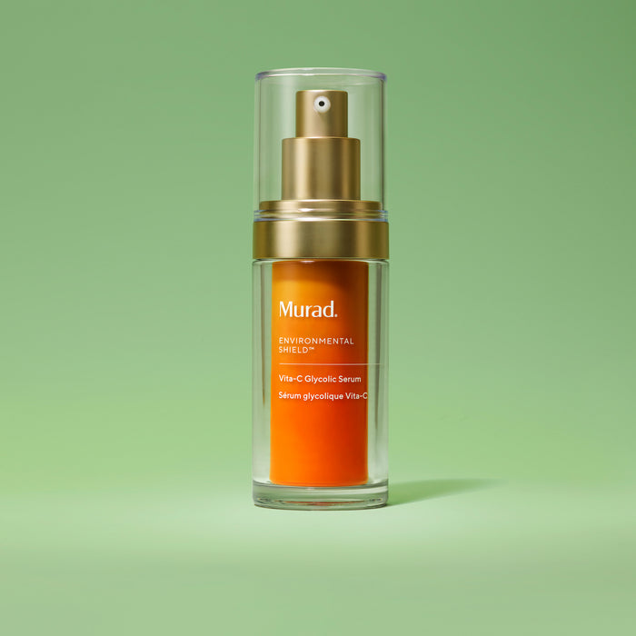 Murad skincare serum bottle on a green background