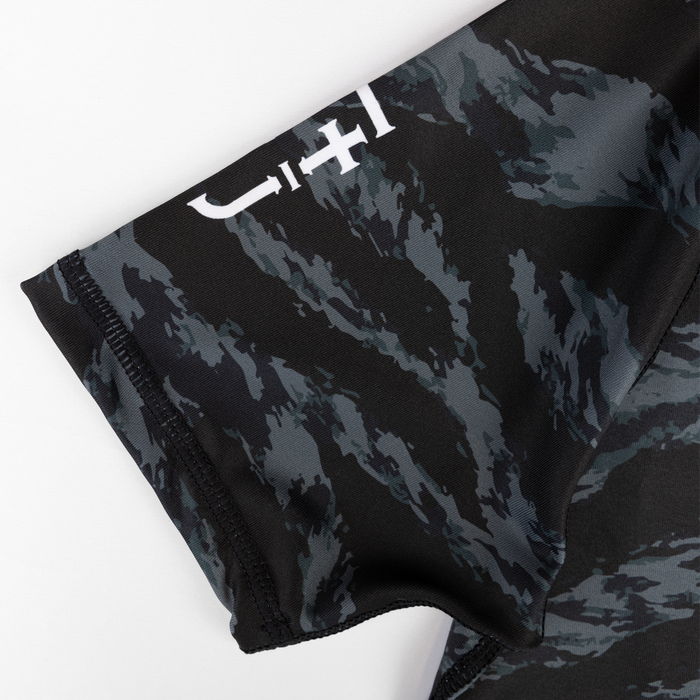 JJJ on sleeve of ladies rashguard
