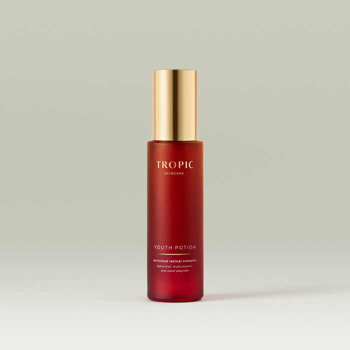 Tropic Youth Potion serum bottle with a gold pump on a neutral background.